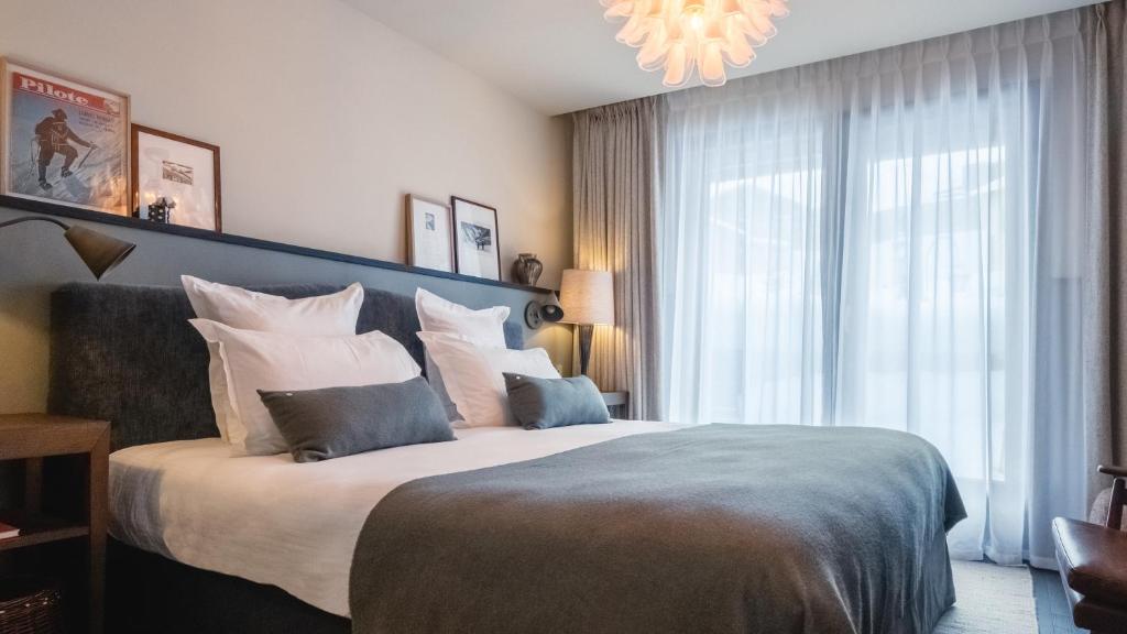 Postel nebo postele na pokoji v ubytování Le Fitz Roy, a Beaumier hotel