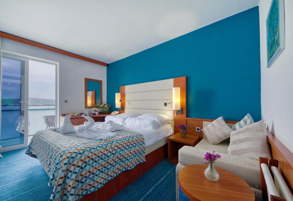 Postel nebo postele na pokoji v ubytování Ilirija Resort Hotel Kornati