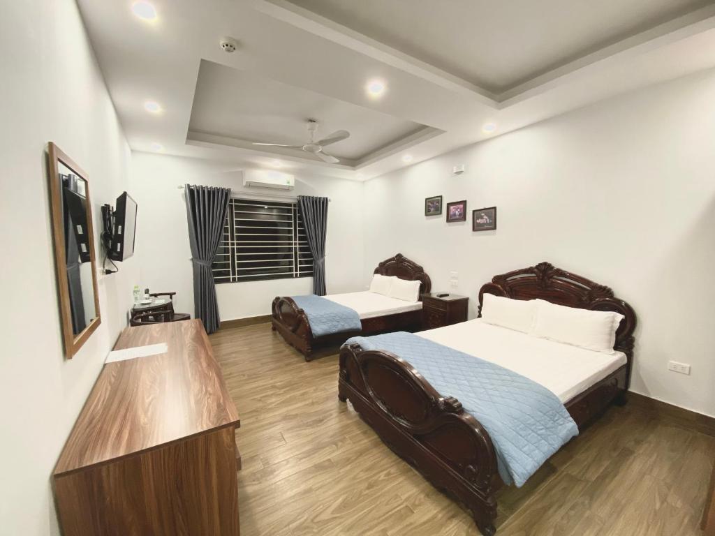 Postel nebo postele na pokoji v ubytování Tien Minh Hotel 113 Le Thanh Nghi