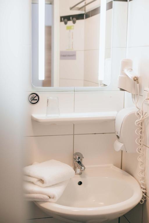 Koupelna v ubytování Hotel Andres