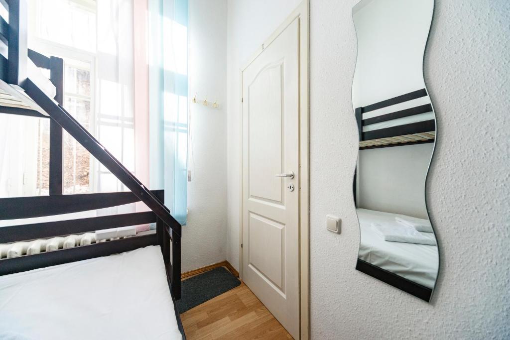 Postel nebo postele na pokoji v ubytování Muzey Hostel