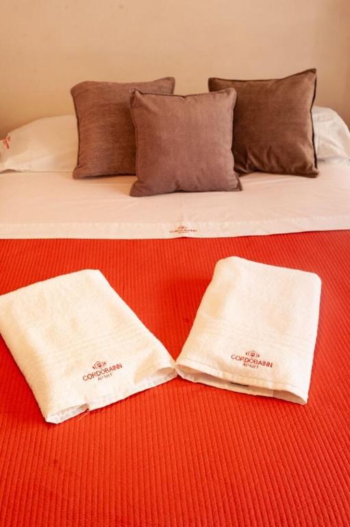 Postel nebo postele na pokoji v ubytování Cordoba Inn Apart Hotel