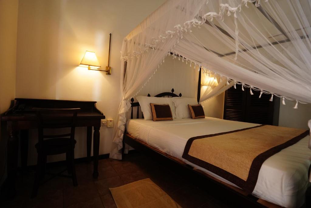 Krevet ili kreveti u jedinici u okviru objekta matara rest house hotel