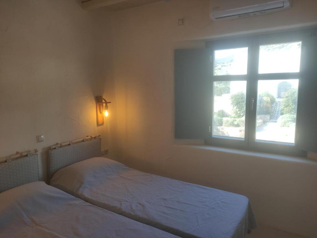 Postel nebo postele na pokoji v ubytování Mosaic Suites