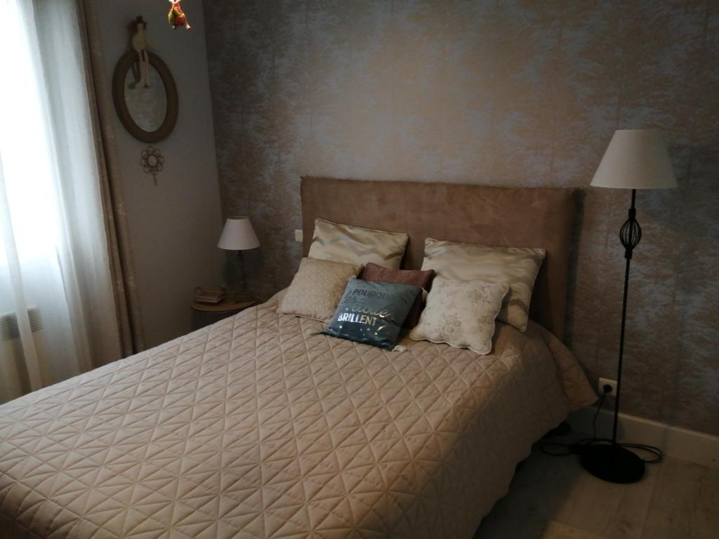Postel nebo postele na pokoji v ubytování La conviviale