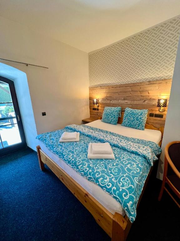 Postel nebo postele na pokoji v ubytování Hotel Jiřičná