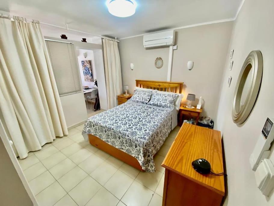 En eller flere senge i et værelse på El Relax del Puerto