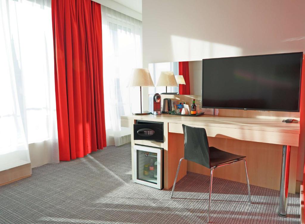 TV a/nebo společenská místnost v ubytování Park Inn by Radisson Linz