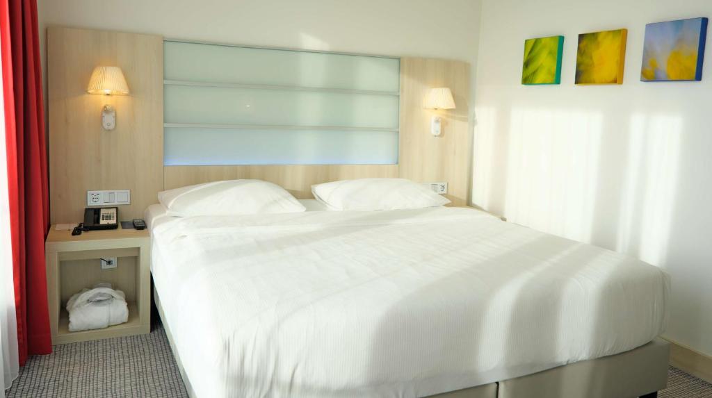 Postel nebo postele na pokoji v ubytování Park Inn by Radisson Linz