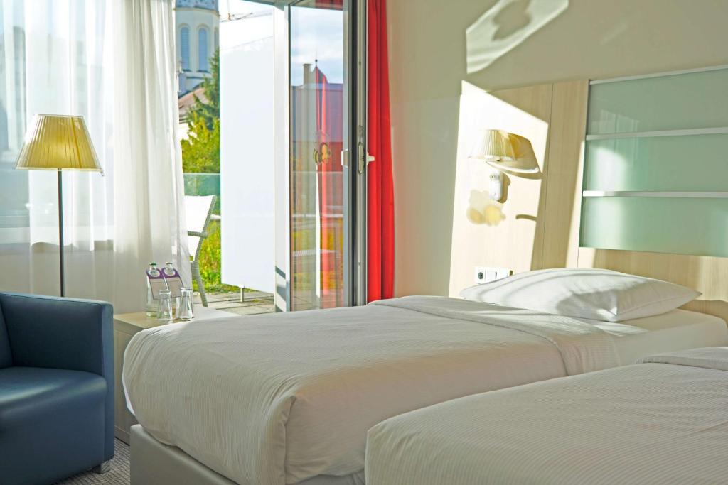 Postel nebo postele na pokoji v ubytování Park Inn by Radisson Linz