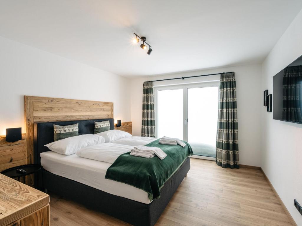 Posteľ alebo postele v izbe v ubytovaní Chalet Mountain Lodge - Klippitztörl by Interhome