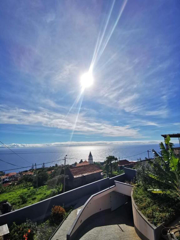 a view of the ocean from the balcony of a house at A Casa Valentina - Estudio vista panorâmica para o mar in Estreito da Calheta