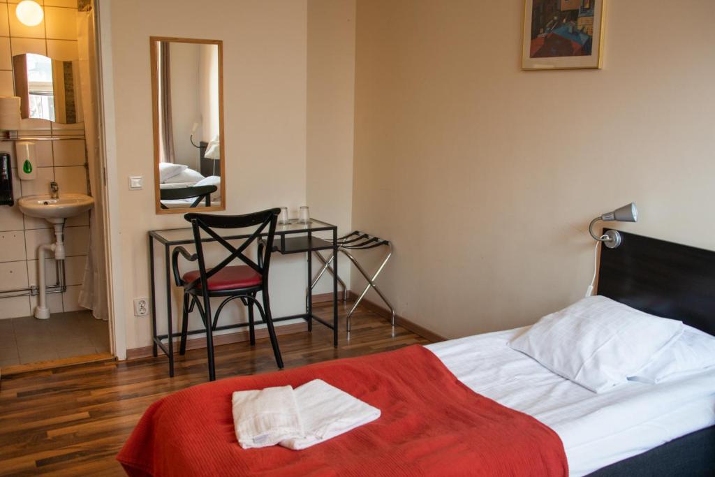 Postel nebo postele na pokoji v ubytování Reimersholme Hotel