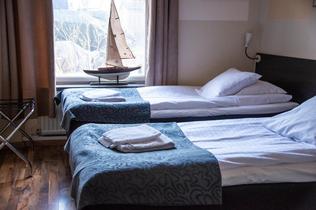 Postel nebo postele na pokoji v ubytování Reimersholme Hotel