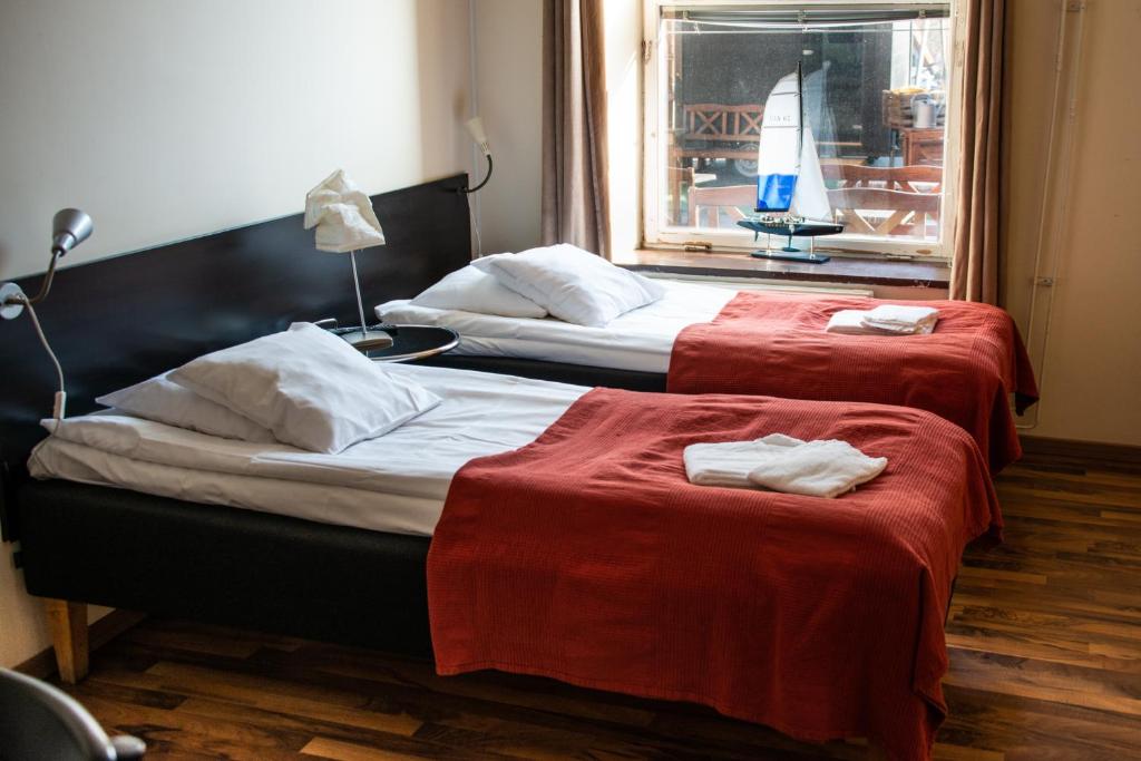 Postel nebo postele na pokoji v ubytování Reimersholme Hotel