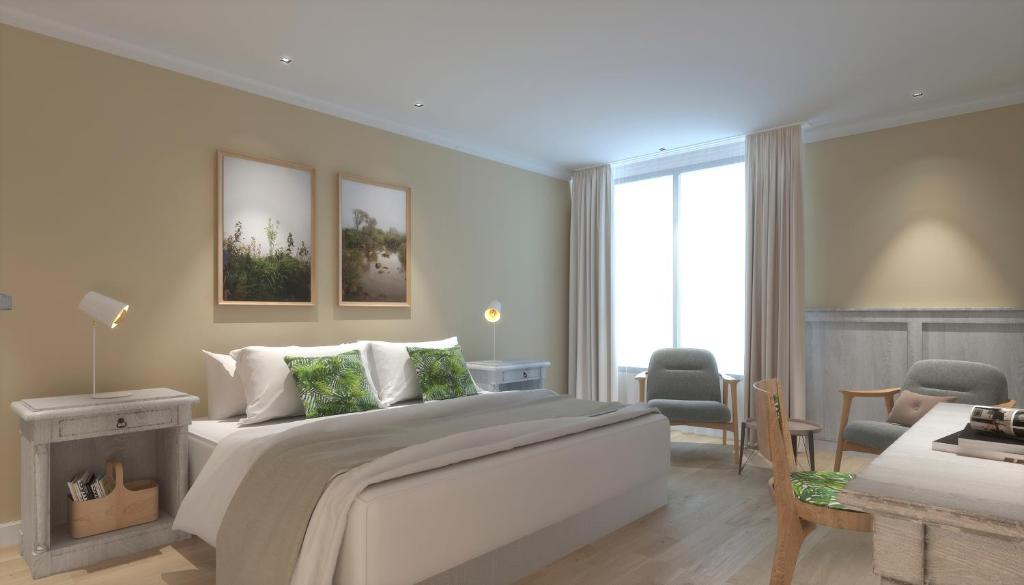 1 dormitorio con 1 cama y sala de estar en Gardi Hotel & Suites en Buenos Aires