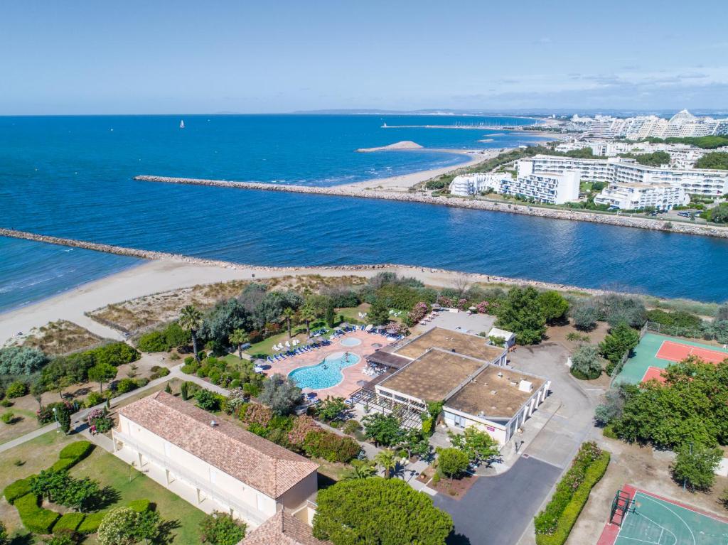 an aerial view of a resort next to the ocean at SOWELL RESIDENCES Les Sablons in Le Grau-du-Roi