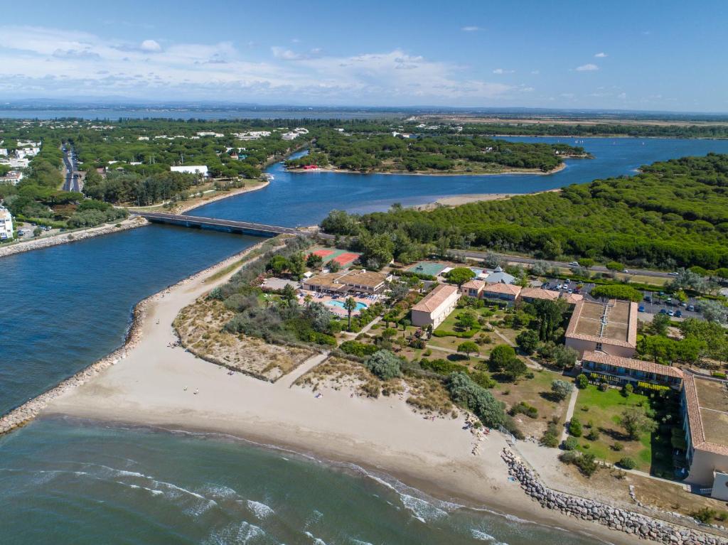 an aerial view of a beach next to the water at SOWELL RESIDENCES Les Sablons in Le Grau-du-Roi