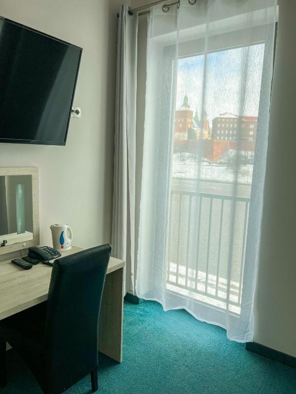 TV a/nebo společenská místnost v ubytování Hotel Poleski