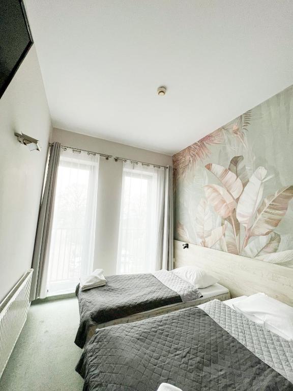 Postel nebo postele na pokoji v ubytování Hotel Poleski