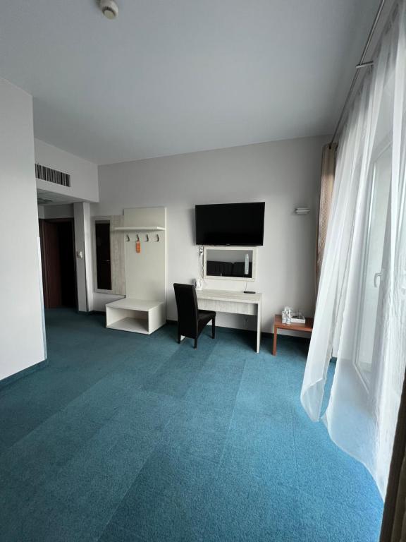TV a/nebo společenská místnost v ubytování Hotel Poleski