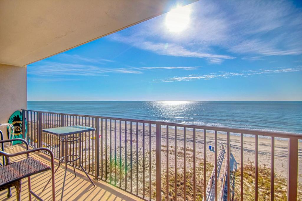 a balcony with a view of the ocean at Sunset Coral in Myrtle Beach