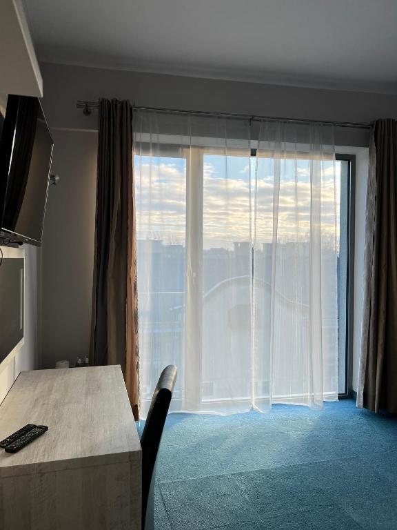 Postel nebo postele na pokoji v ubytování Hotel Poleski