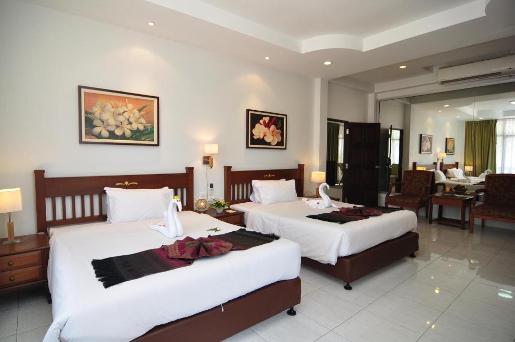 Postel nebo postele na pokoji v ubytování Phuket Leelavadee Hua Ting Resort