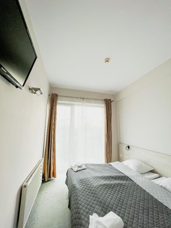 Postel nebo postele na pokoji v ubytování Hotel Poleski