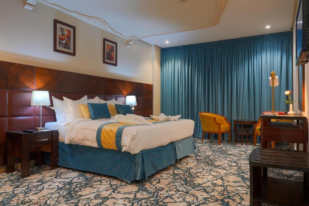 Postel nebo postele na pokoji v ubytování Saraya Al Deafah Hotel