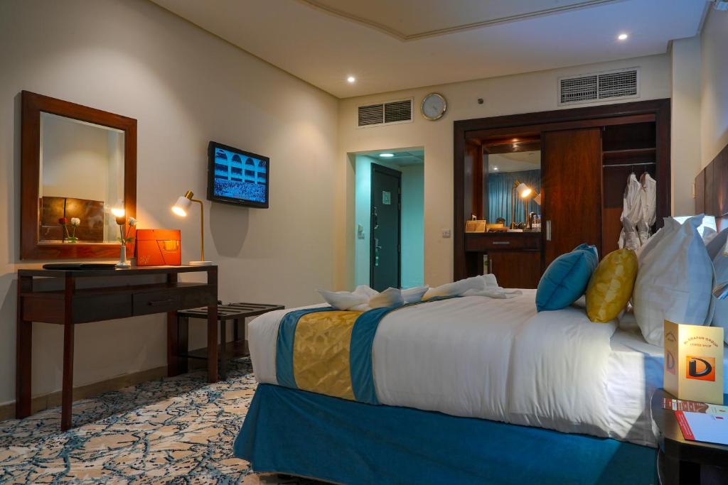 Postel nebo postele na pokoji v ubytování Saraya Al Deafah Hotel