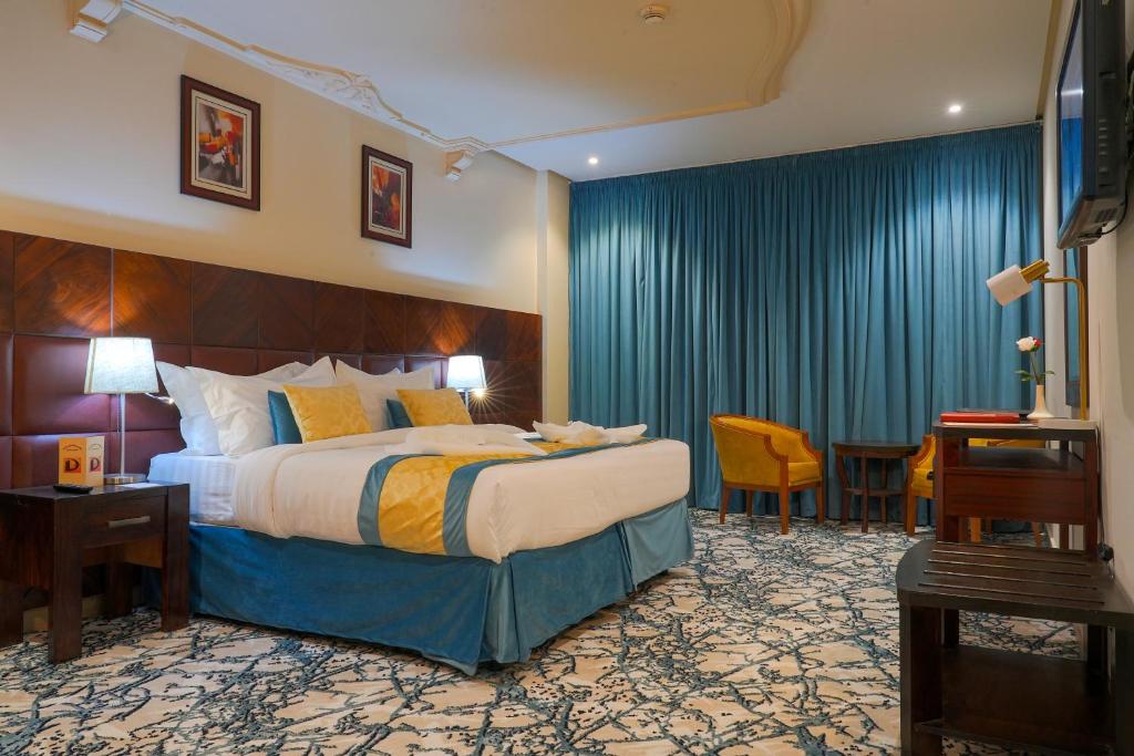 Postel nebo postele na pokoji v ubytování Saraya Al Deafah Hotel