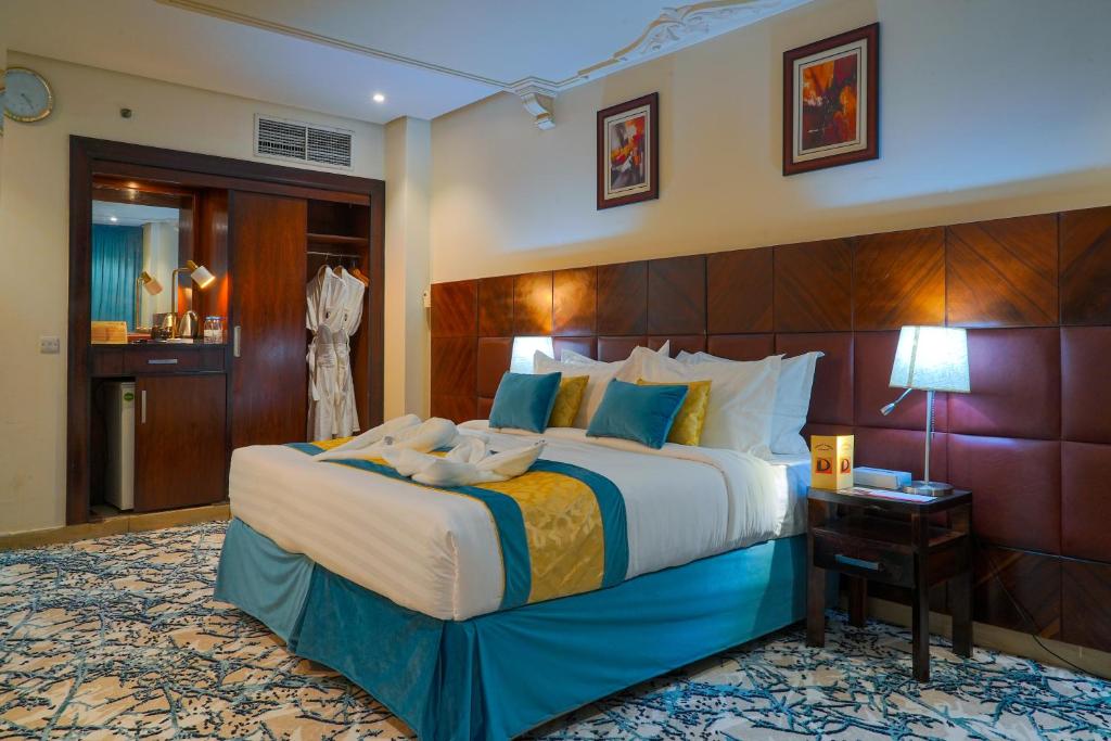 Postel nebo postele na pokoji v ubytování Saraya Al Deafah Hotel