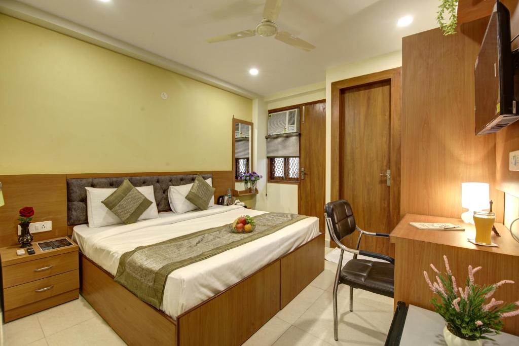 Un pat sau paturi într-o cameră la Hotel TMS Grand