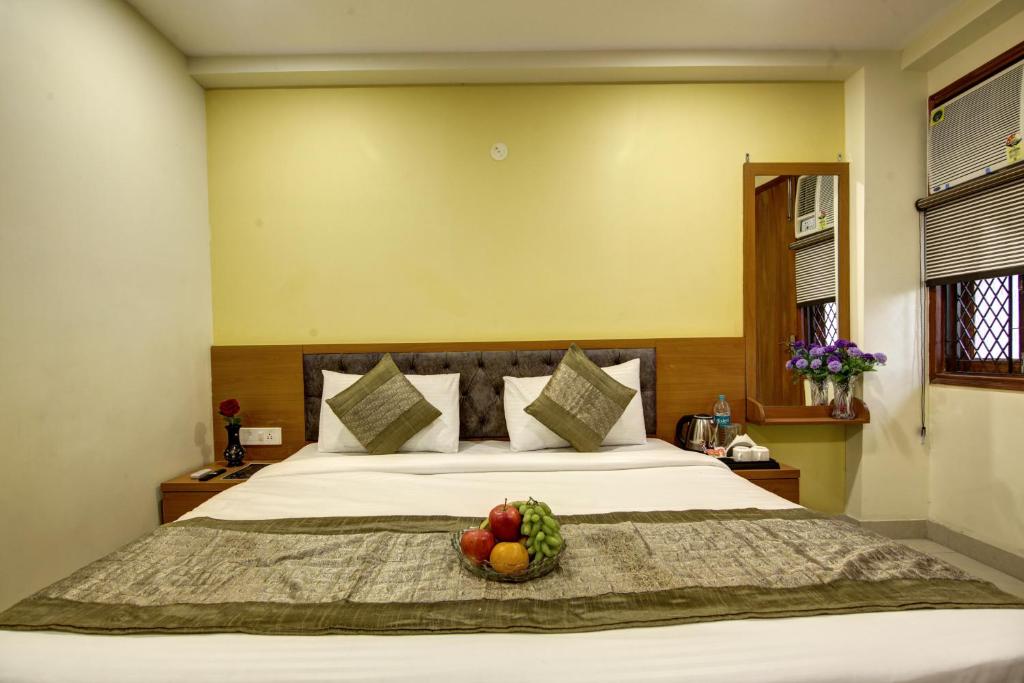 Postel nebo postele na pokoji v ubytování Hotel TMS Grand
