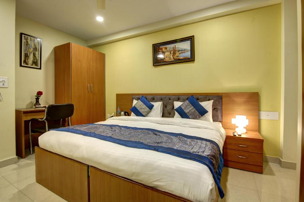Postel nebo postele na pokoji v ubytování Hotel TMS Grand