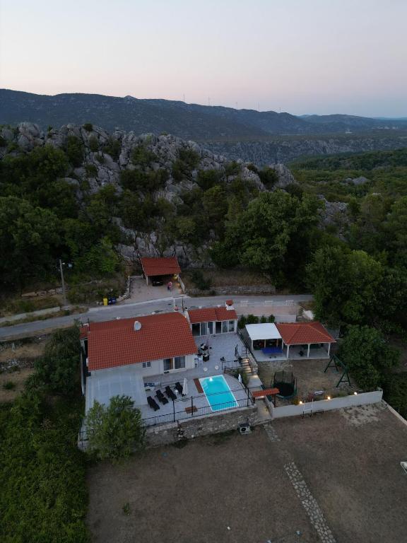 an aerial view of a house with a swimming pool at Villa Zrinka **** in Svinišće