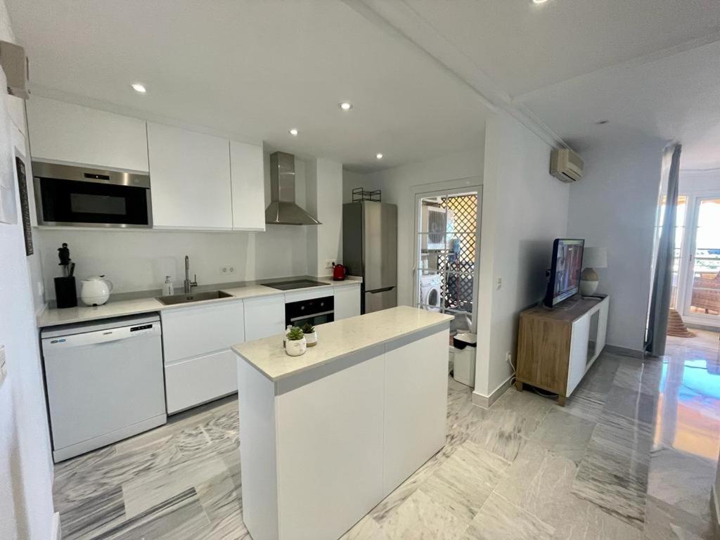 A kitchen or kitchenette at Walking distance to Puerto Banus sea view Apartment