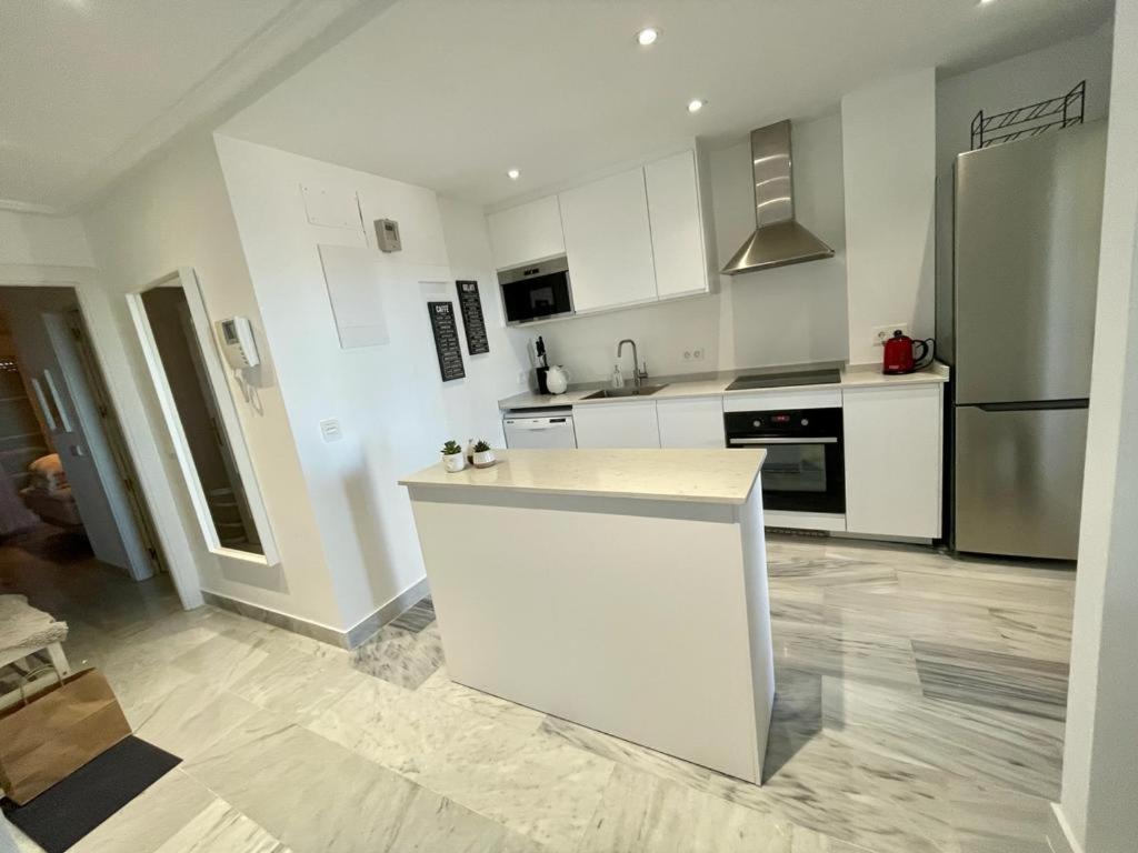 A kitchen or kitchenette at Walking distance to Puerto Banus sea view Apartment