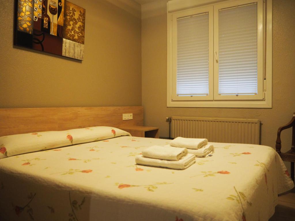 Postel nebo postele na pokoji v ubytování Hostal Acella