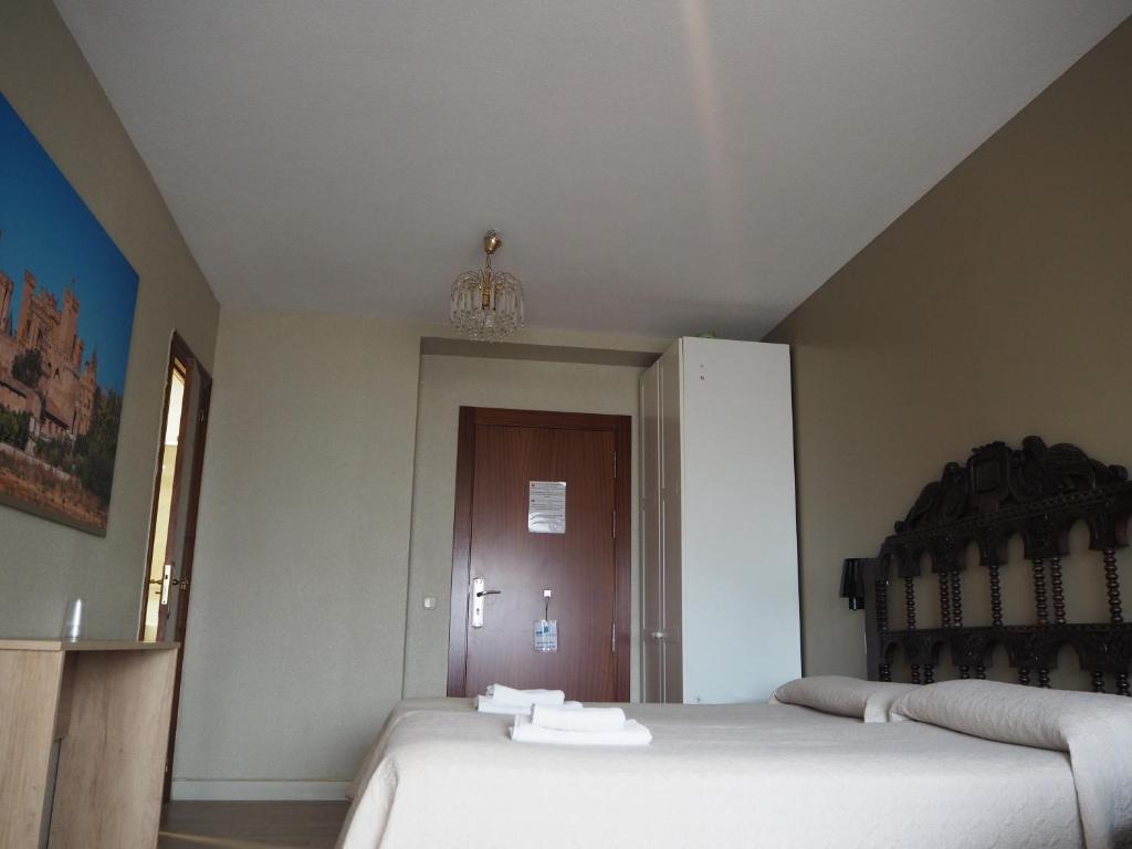 Postel nebo postele na pokoji v ubytování Hostal Acella