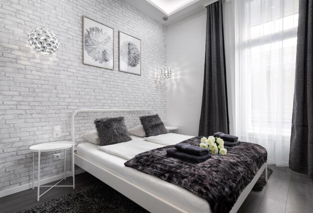 Postel nebo postele na pokoji v ubytování VP12 Apartments