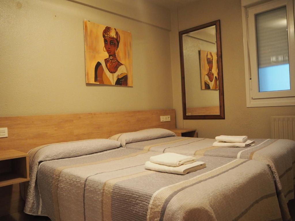 Postel nebo postele na pokoji v ubytování Hostal Acella