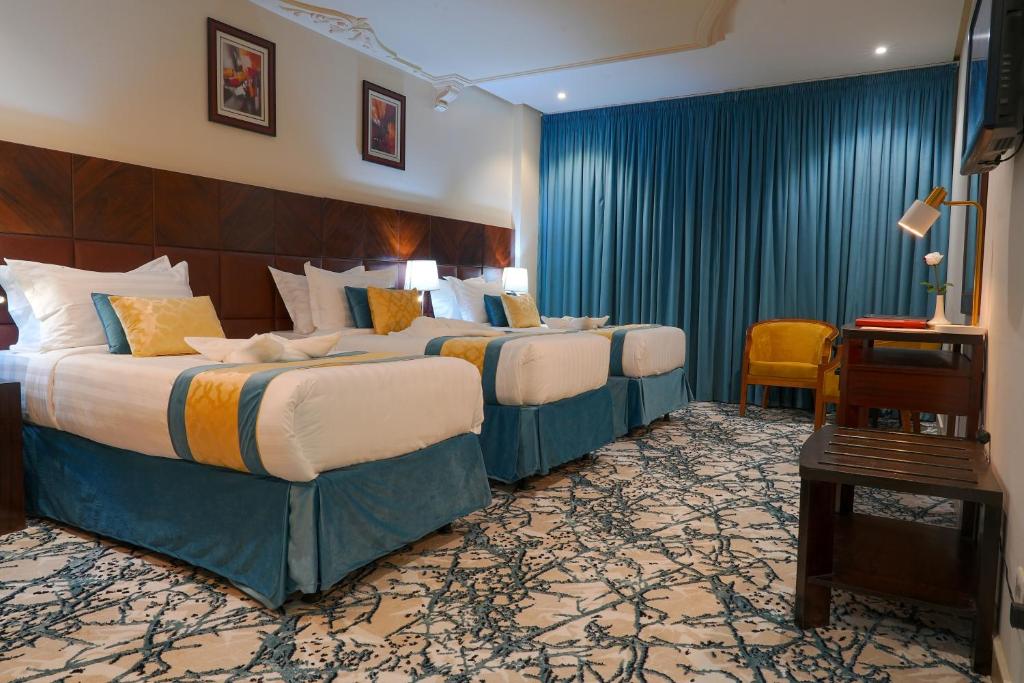 Postel nebo postele na pokoji v ubytování Saraya Al Deafah Hotel