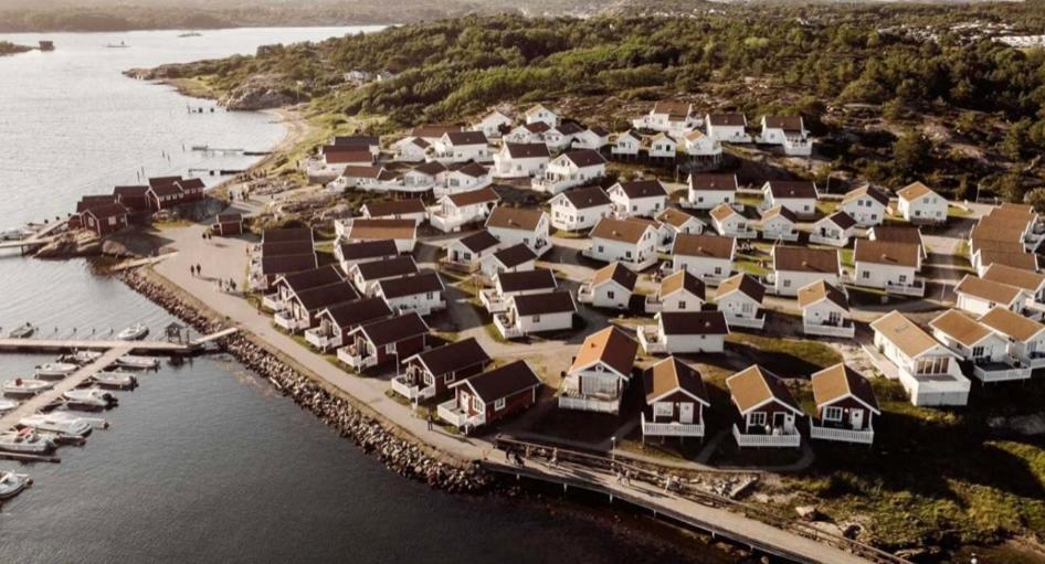 an aerial view of a village next to the water at Tanumstrand SPA & Resort Stugor in Grebbestad