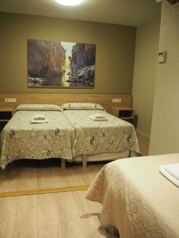 Postel nebo postele na pokoji v ubytování Hostal Acella