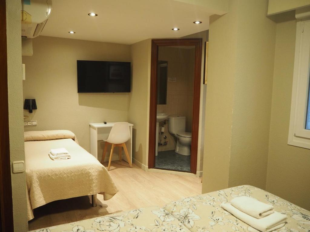 TV a/nebo společenská místnost v ubytování Hostal Acella