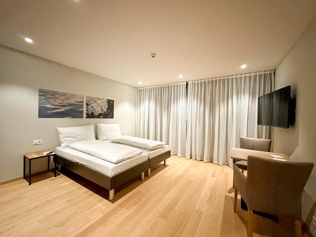 Postel nebo postele na pokoji v ubytování Aparthotel Beinwil am See