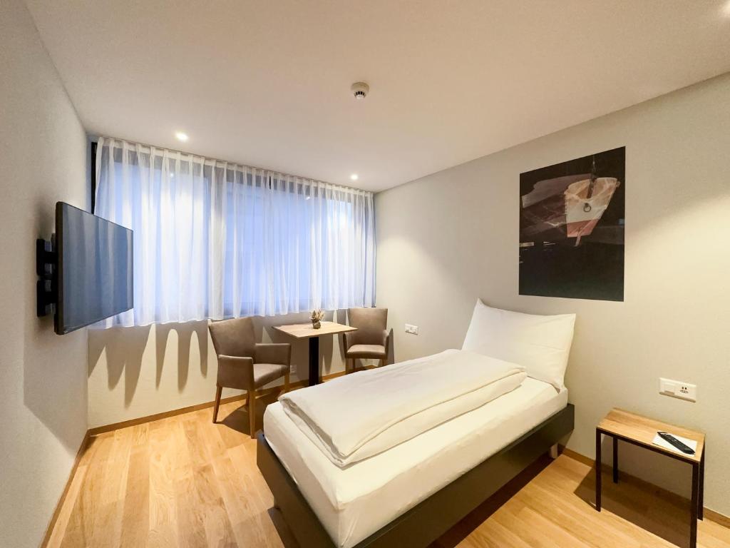 Postel nebo postele na pokoji v ubytování Aparthotel Beinwil am See