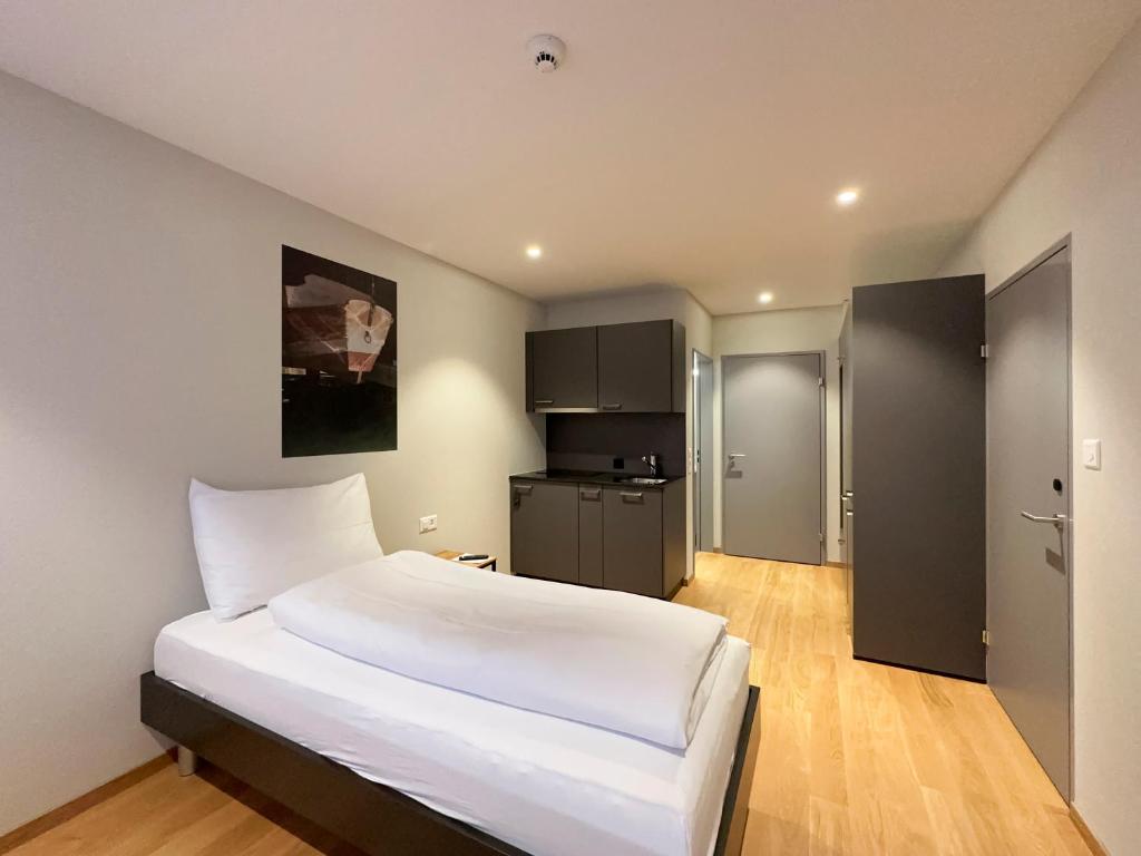 Postel nebo postele na pokoji v ubytování Aparthotel Beinwil am See